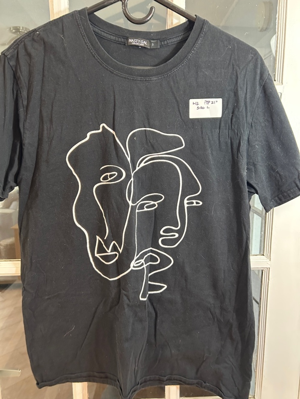 L12.    Nasty Gal Black Tee with White Abstract Line-Face Graphic